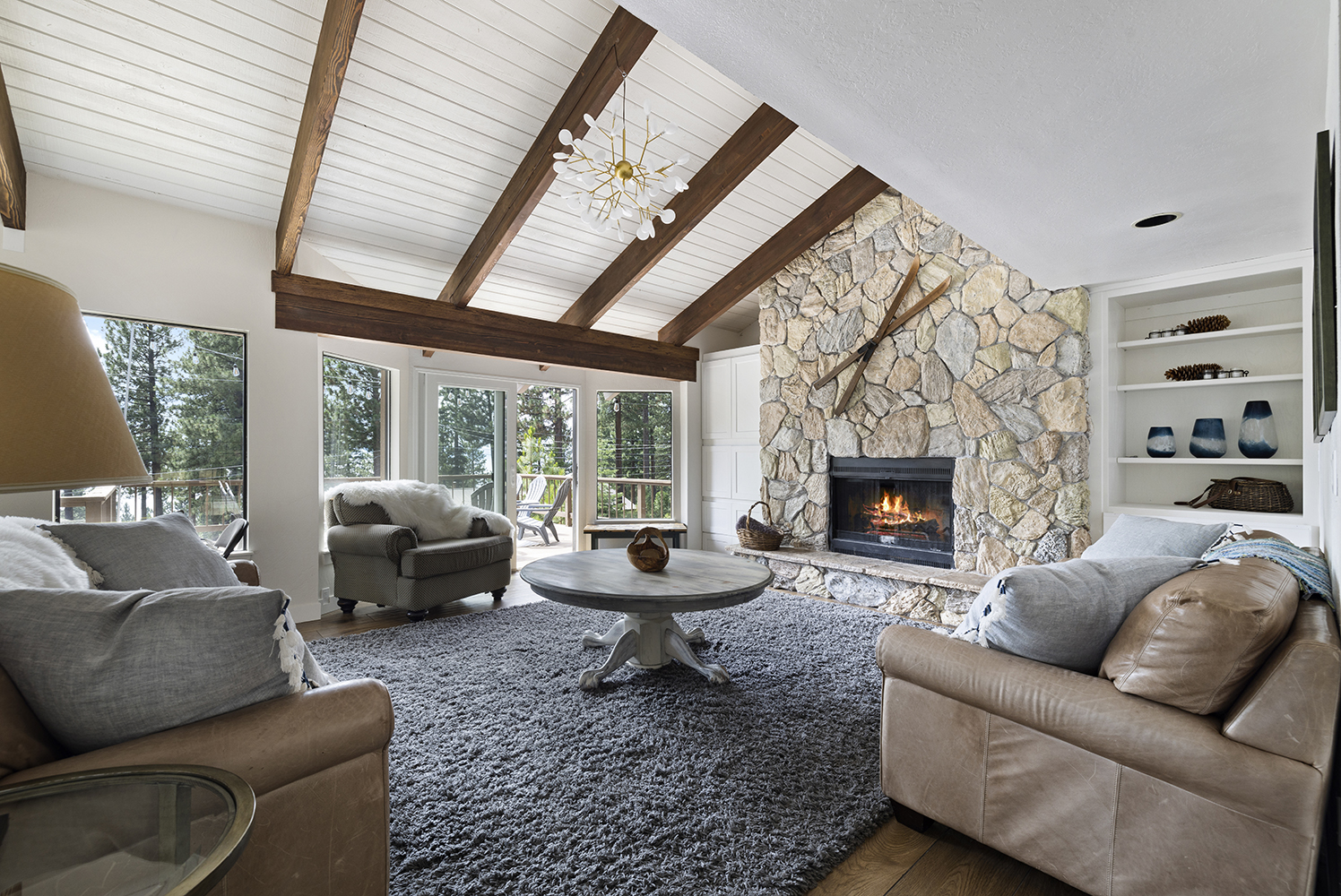 Living room with stone fireplace at Kinpine House